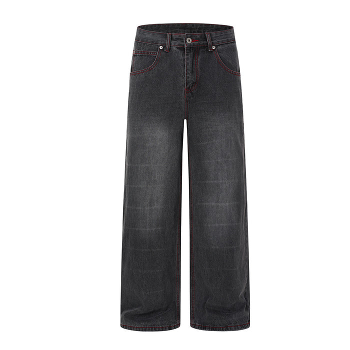 Wide-leg washed black denim jeans with gothic wing and star print on back panel and red contrast stitching