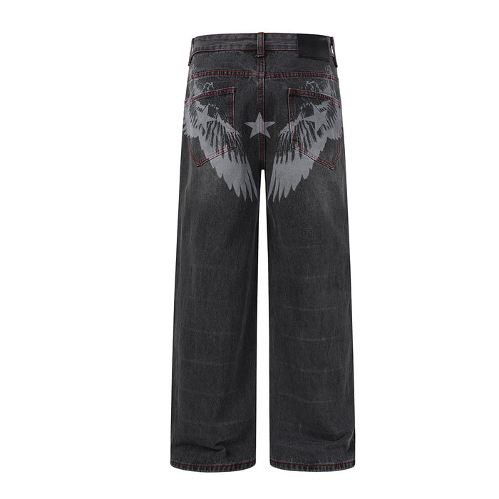Back view of washed black wide-leg jeans featuring gray wing graphics and a star between the back pockets