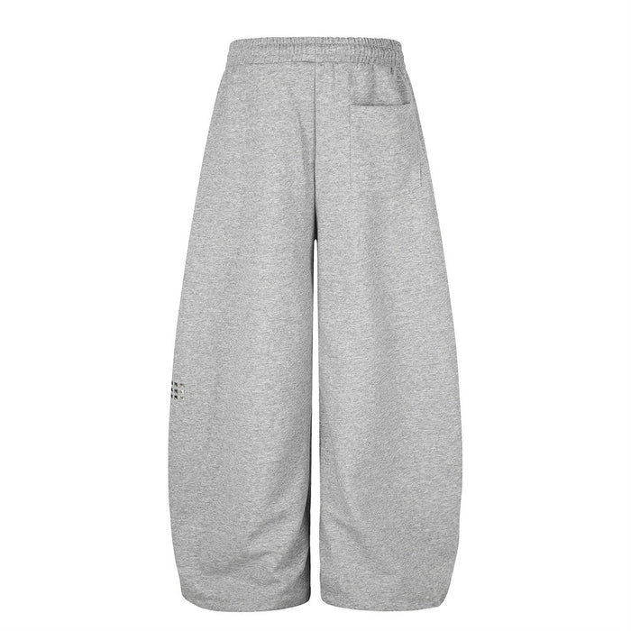 Gray wide leg sweatpants back view with single patch pocket and small rhinestone detail on leg