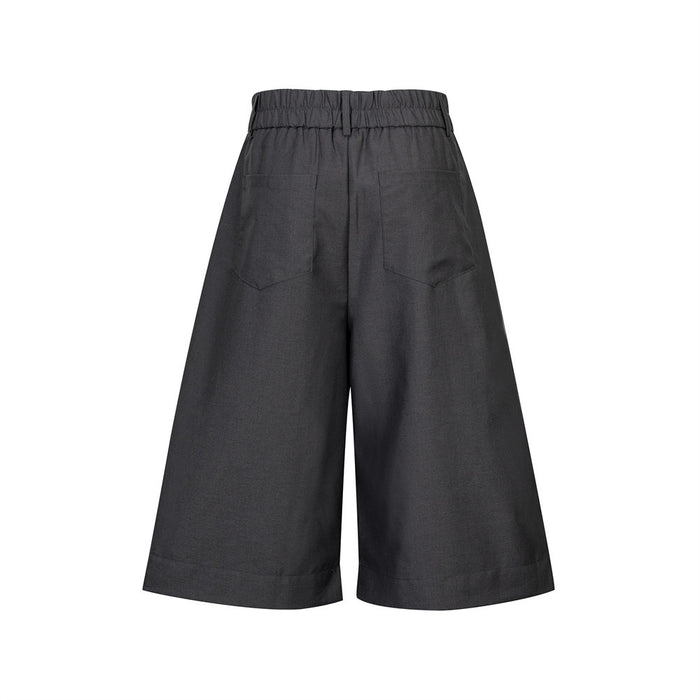 Back view of charcoal gray wide-leg culottes shorts with elastic waistband and patch pockets