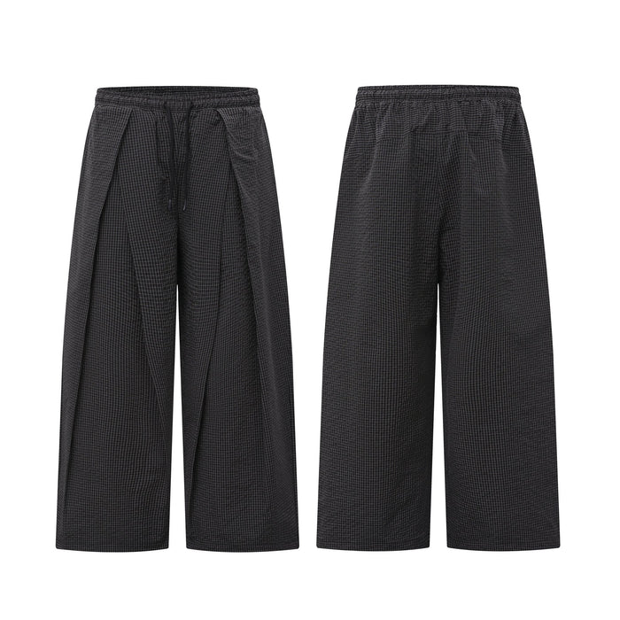 Front and back view of dark charcoal wide-leg pleated pants with check texture and elastic drawstring waistband