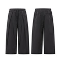 Front and back view of dark charcoal wide-leg pleated pants with check texture and elastic drawstring waistband