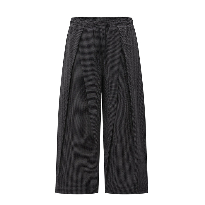 Black wide-leg pleated pants with a textured check pattern and drawstring waistband, front view