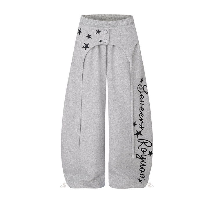 Wide-leg star print hip-hop sweatpants with fold-over snap waistband and script leg graphic in grey and red