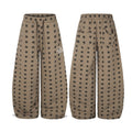 Taupe wide-leg sweatpants shown front and back with an allover black star print