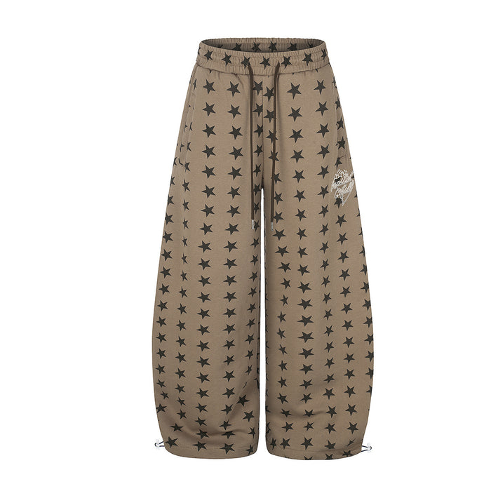 Wide-leg khaki sweatpants with all-over dark star print, drawstring waist, and ankle toggle hem, front and back view