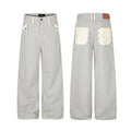 Wide-leg gray and white striped jeans shown front and back with contrasting cream pockets
