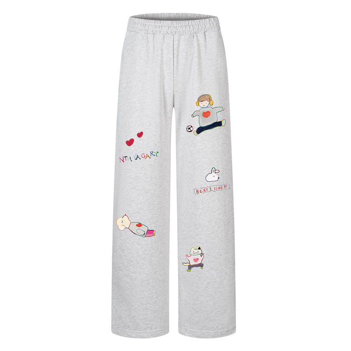 Gray wide-leg sweatpants with an elastic waistband and colorful cartoon, heart, and text prints on the front