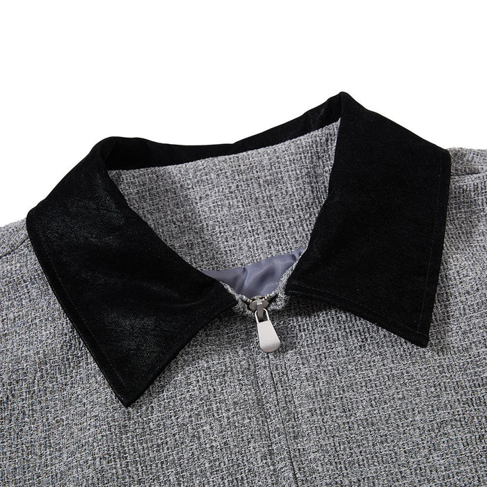 Close-up of the black pointed collar, grey tweed weave, and silver front zipper pull